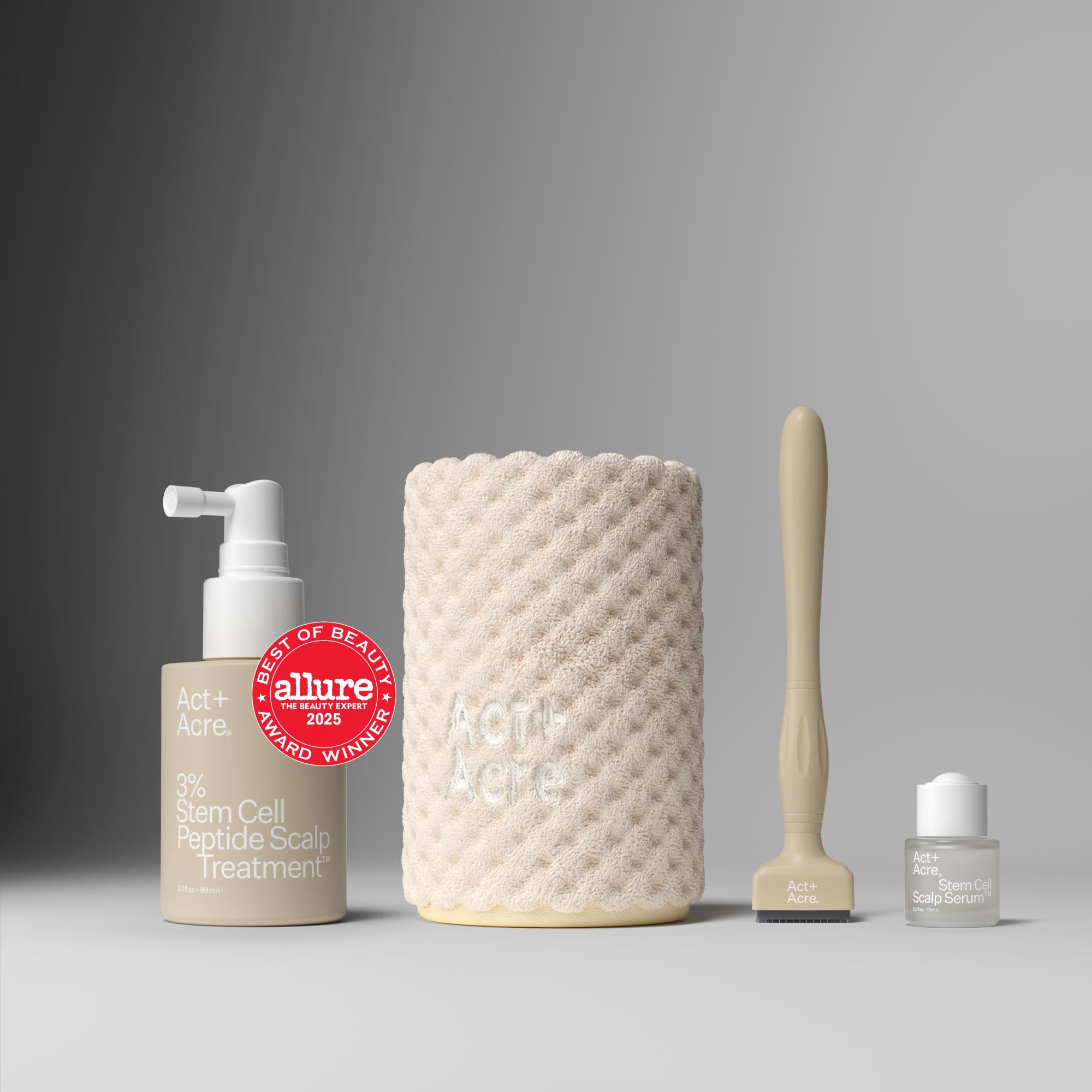 Skincare products including a bottle, a textured jar, and a brush on a gray background with an 'Allure' award badge.